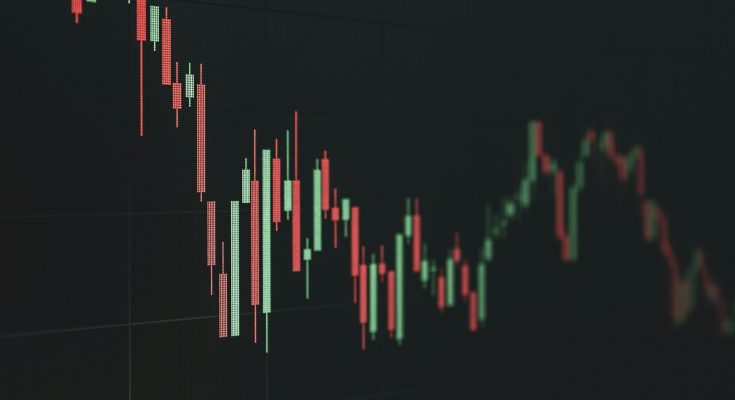 Stock market chart shows a declining trend.